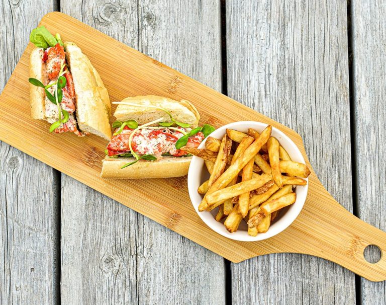 Plated sandwich and fries at The Coast at The North Star in Louisbourg
