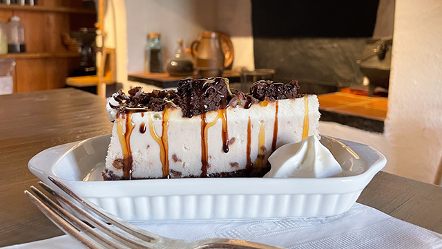 Chocolate and caramel cheesecake served inside Café L’Épée Royale at the Fortress of Louisbourg Chocolate and caramel cheesecake served inside Café L’Épée Royale at the Fortress of Louisbourg